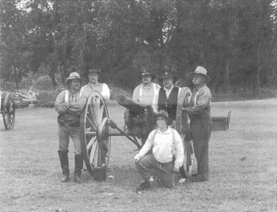 Men grouped around a cannon